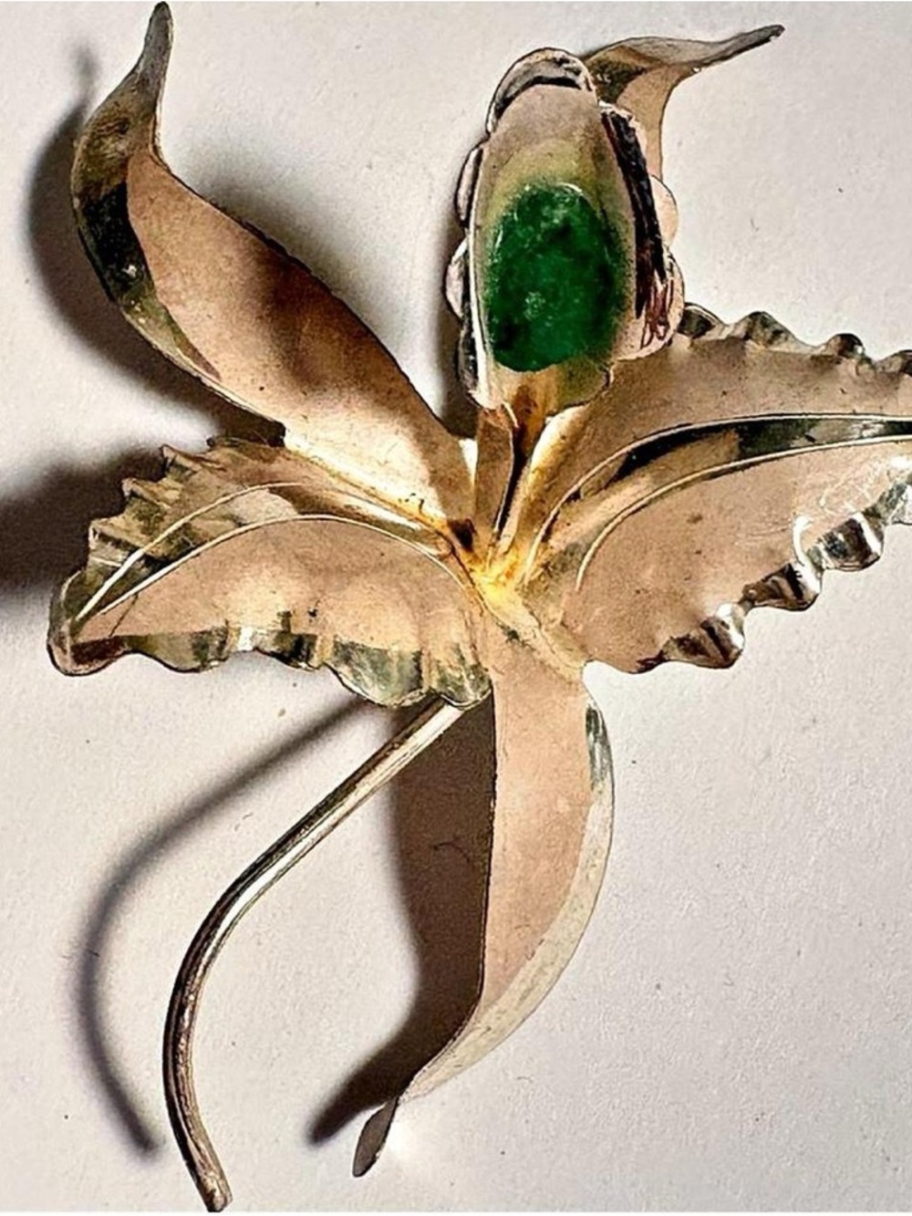 Vintage Silver tone metal orchid brooch with green stone accents